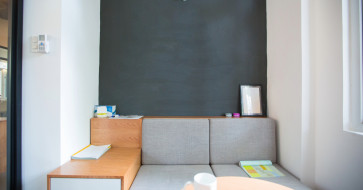 Modular furniture setup in a small modern living room, showcasing customizable and space-saving design solutions.